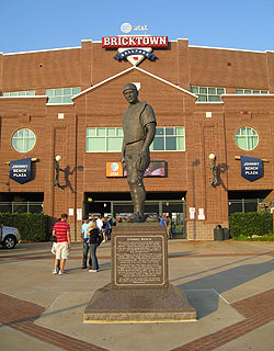 The ballpark's distinctive red brick exterior is seen behind the statue of Johnny Bench, who was born in Oklahoma City