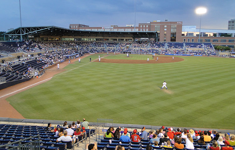 The outfield grandstand view of Durham Bulls Athletic Park and the historic American Tobacco Campus