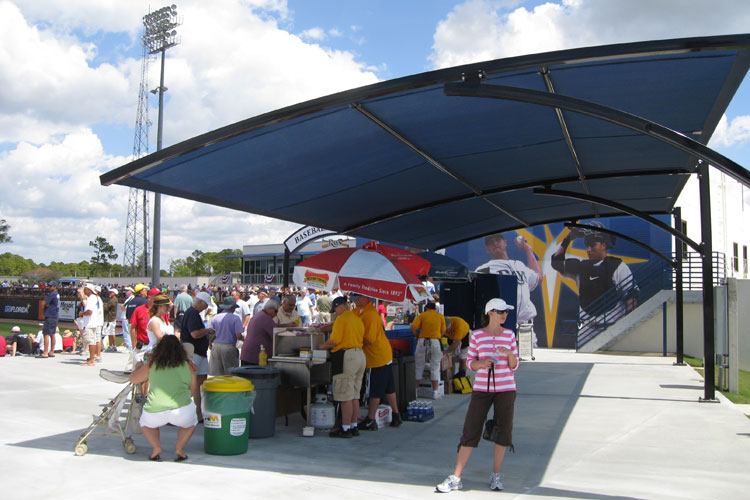 Canopies cover concession carts behind each berm