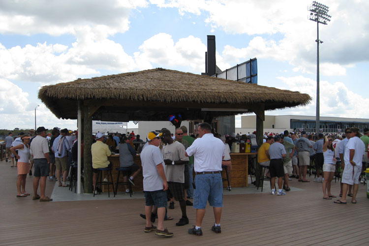 A tiki hut-style bar is on the boardwalk in left-center field