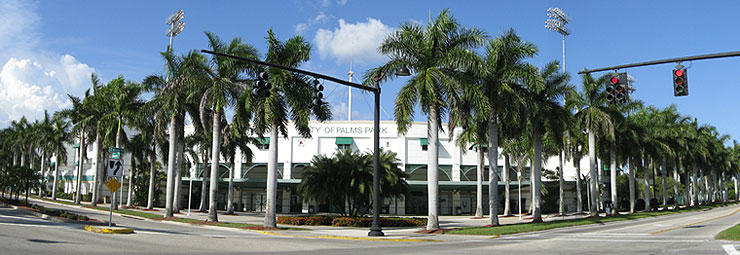 Palm tree lined streets lead to the main entrance of City of Palms Park