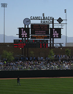 Distant mountain ranges and an angular scoreboard add to the ambiance of  Camelback Ranch