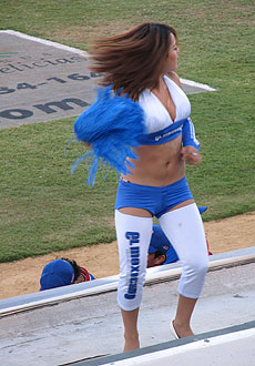 The Tijuana Potros cheerleaders dance on top of the dugout