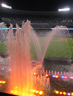 The fountains at Kauffman Stadium light up at night thanks to multi-colored floodlights