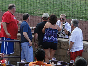 Colts fans reward a player as part of the Home Run Dollar Program at Foster Field