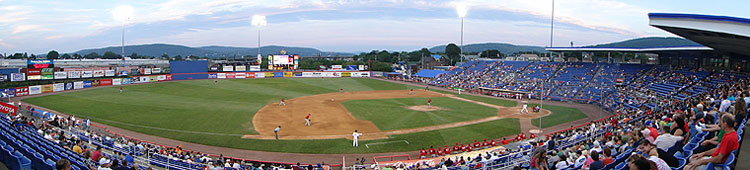 Blue hued NYSEG Stadium overlooks the rolling hills of the Catskills