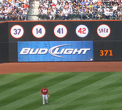 Look to left field for markers of Mets history, such as these retired numbers and name (Shea)