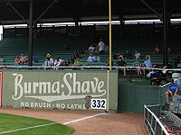 Throwback ads adorn the outfield walls of Birmingham's throwback ballpark