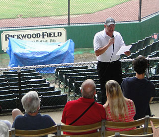 Art Clarkson speaks to a crowd at Rickwood Field