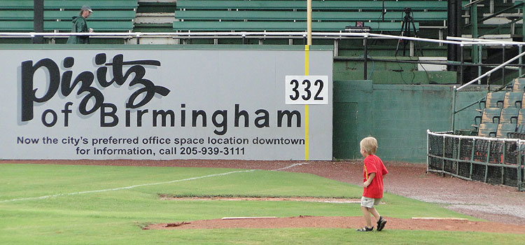 A young fan enjoys his opportunity to be on Rickwood's field