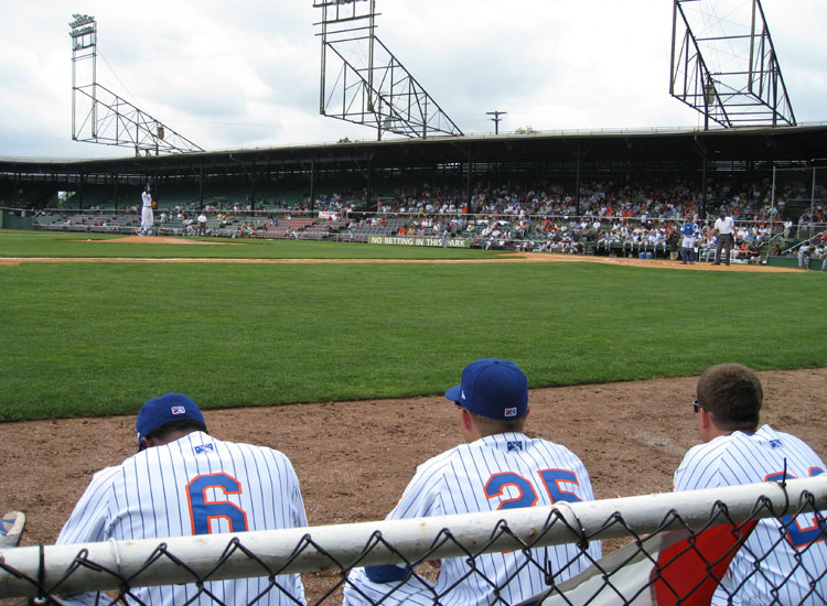 Visiting players sitting on folding chairs at Rickwood Field